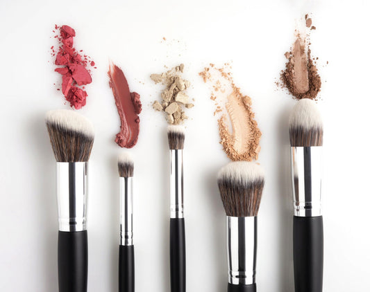 Insert a captivating image of makeup brushes and products arranged beautifully